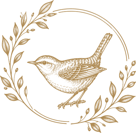 Wren & Co. emblem: an engraved wren perched within a wreath